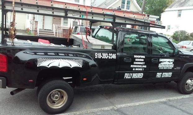 Service vehicle for Leak Proof Roofing & Construction LLC